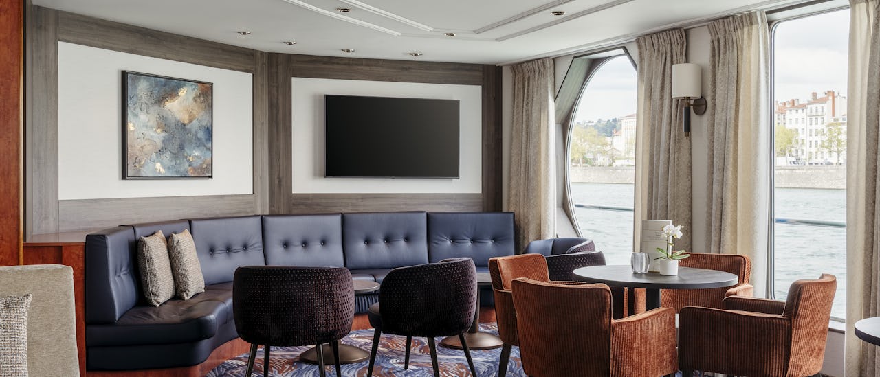 Enjoy the passing landscape with a cool drink in the bar